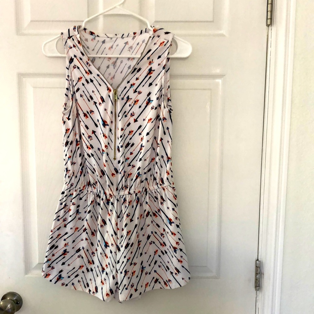 White with arrow design romper